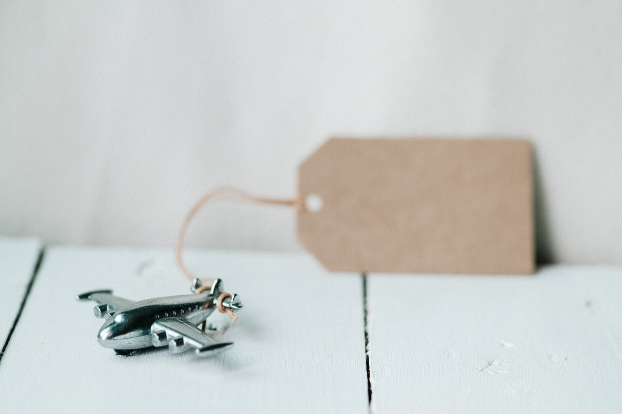 airplane figurine with tag attached