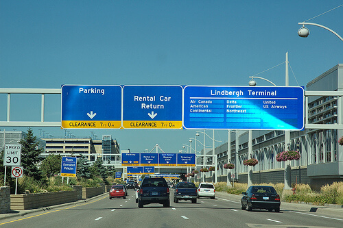 airport signs above road