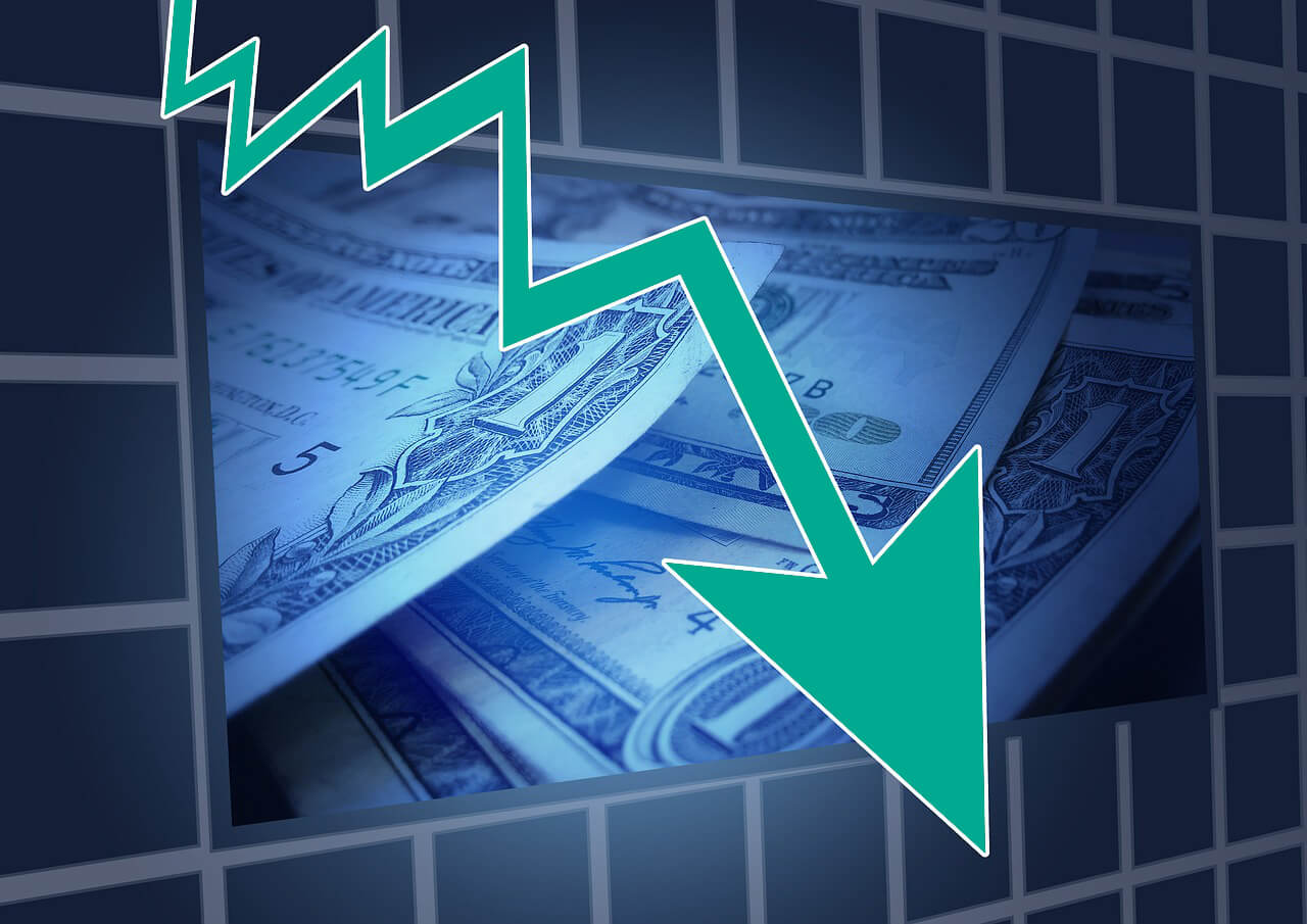 graphic of stock arrow going downward over dollar bills