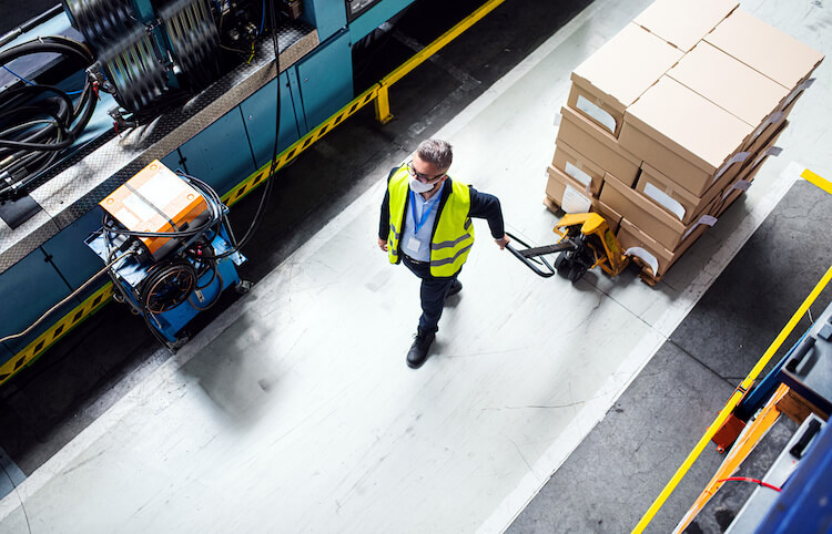 man workeing in warehouse with protective mask
